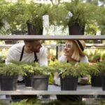 medium-shot-smiley-people-greenhouse-min